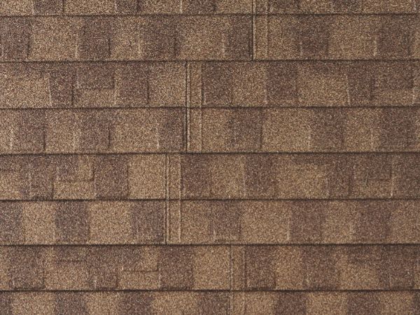 English Suede Ridge Shingle stone-coated metal roofing in warm gold shades