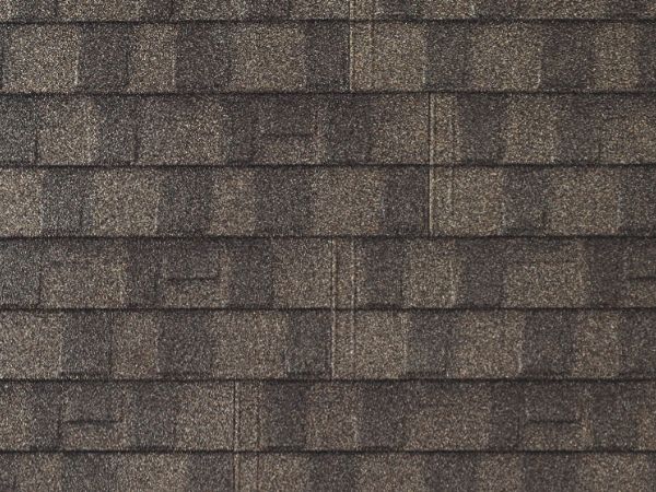 Ironwood Ridge Shingle stone-coated metal roofing with dark gray earthy texture