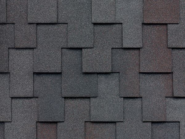 Close-up of Malarkey Windsor Black Oak shingles in deep black with oak-brown accents for sophisticated roofing