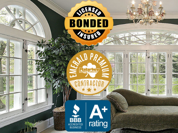 Beautiful sunroom with large energy-efficient windows installed by Fisher Construction, a licensed, bonded, and insured Emerald Premium Contractor with an A+ BBB rating.