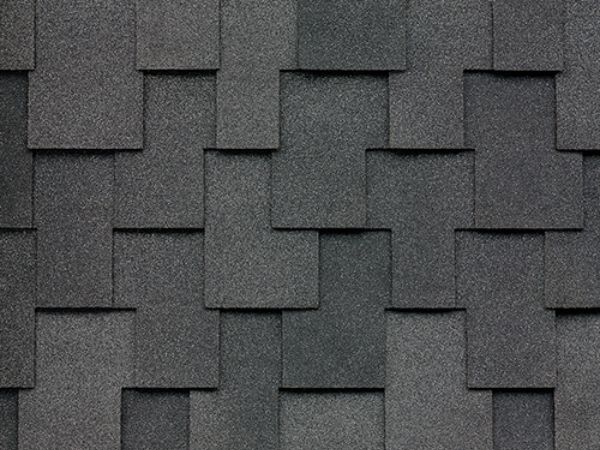 Close-up of Malarkey Windsor Midnight Black shingles in deep black with textured finish for elegant roofing