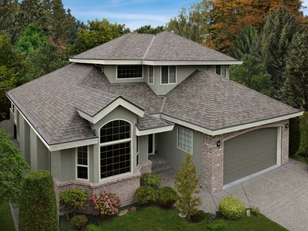 House with Malarkey Natural Wood asphalt shingle roof in light brown for a rustic wood-grain aesthetic
