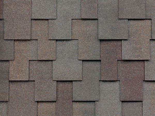 Close-up of Malarkey Windsor Natural Wood shingles in light brown with wood-grain texture for a rustic roof
